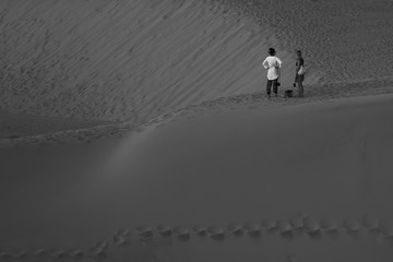 A people walking in the desert