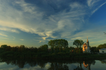 Fototapeta na wymiar river church trees summer sky vologda