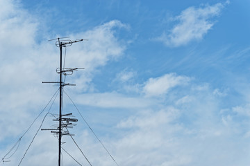 Television aerial against cloudy sky. Komsomolsk-on-Amur, Russia