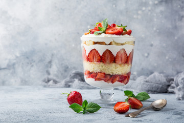 Strawberry trifle. layered dessert with fresh berry and cream cheese - obrazy, fototapety, plakaty