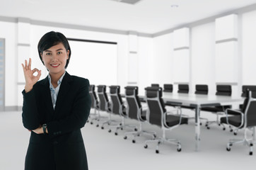 businesswoman standing with arms folded.