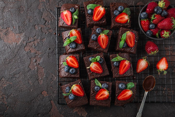 chocolate brownies  with fresh strawberry and blueberry - Powered by Adobe