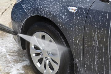 car washing. Cleaning Car Using High Pressure Water