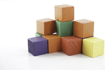 Obraz premium Wooden cube blocks over white background