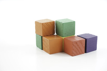 Wooden cube blocks over white background