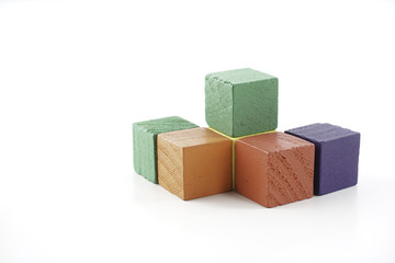 Wooden cube blocks over white background