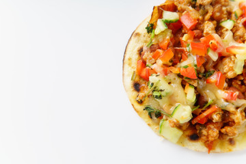 Close up of mexican taco with chili con carne, grilled sweet potatoes and grated cheese on white background. Text space