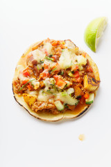 Mexican tacos with chili con carne, grilled sweet potatoes and grated cheese on white background. Text space