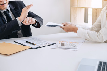 Bribery and corruption concept, senior businessman manager refusing receive money in the envelope...