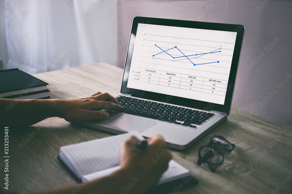 Poster professional at work, businessman writing report and using laptop working analysis investment connec