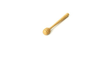 Honey dripping from a wooden honey dipper