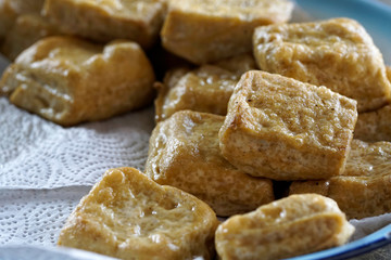 Selective focus. Fresh fried tofu. Healthy and vegan food style.