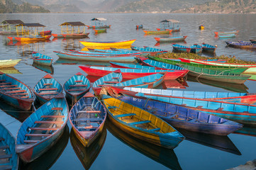 Fototapeta na wymiar Colorful boats on Fewa Lake