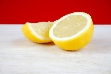 Lemon slices over red background. Space for text. Selective focus