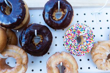 Fresh assorted Donuts on display at outdoor picnic