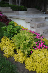 decorative steps of stone with a nearby flower garden