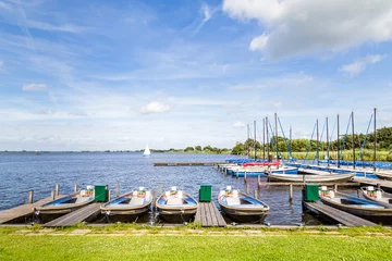 Fototapete Pier Water landscape with small sailboats in the harbor of a lake called Leekstermeer in Drenthe in the Netherlands  © Hilda Weges