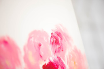 Artist close-up painting flowers.