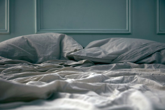 Empty unmade bed