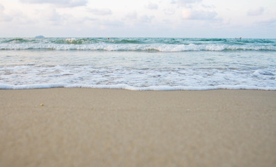 The sea waves on the beach in the morning, the sun is not soft focus