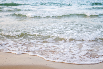 The sea waves on the beach in the morning, the sun is not soft focus