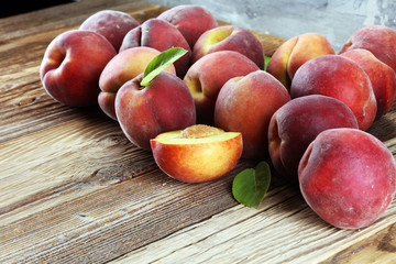 A group of ripe peaches on table