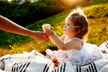 mom gives her daughter ice cream