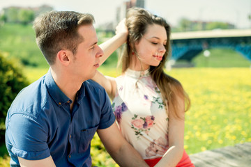 Happy couple in love having fun outdoors and smiling.