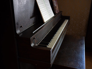 Old antique vintage piano with sheet music