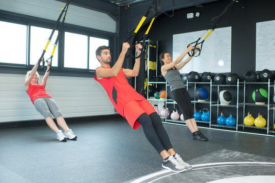 group training with trx suspension at fitness club