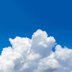 Blue sky with white cumulus clouds. Aspect ratio 1:1 
