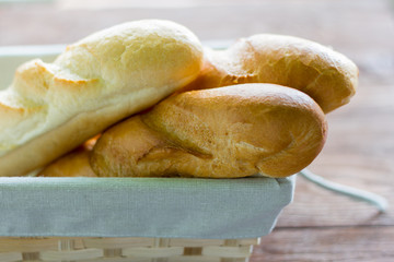 fresh baguettes close-up on wooden background