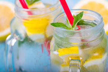 citrus fresh lemonade soda ice mint lemon wooden background
