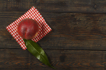 Peach fresh juice with fresh peaches on a dark background. Top view, copy space. Healthy eating. Fresh juice with peach.
