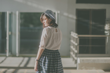 Beautiful Asian woman stand alone and miss someone