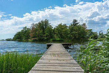 Beautiful coastal landscape with a jetty and an island in Kalmar, Sweden © DZiegler