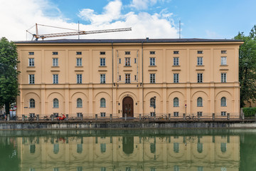 Fototapeta na wymiar Munich, Germany June 09, 2018: Building at the Isar-Werkkanal in Munich