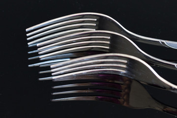 three silver forks