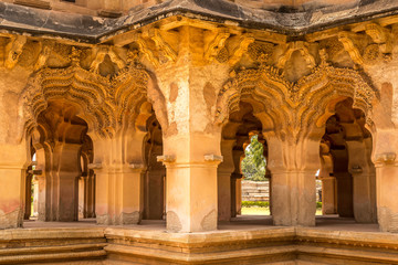 Fototapeta premium Beautiful carved stone arch. Lotus Mahal Temple in Hampi, Karnataka, India.