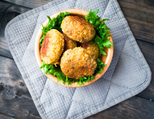 Fried chickpea falafel and leaves of green salad
