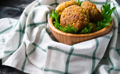 Fried chickpea falafel and leaves of green salad