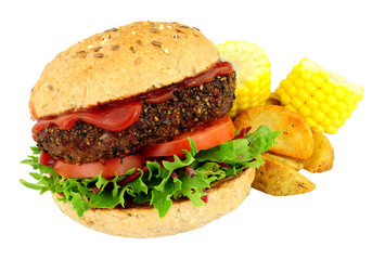 Peppered beef grill steak burger with fresh salad, potato wedges and corn on the cob isolated on a white background