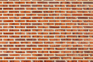 Brick wall seen from tiling, coarse, in red, black and white colors