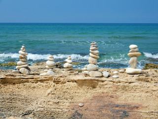 Figures on the sea coast, built of stones by people.