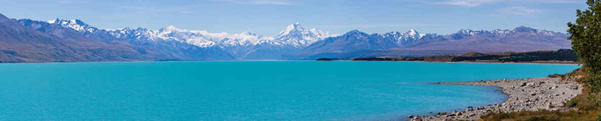 Panoramic view of Mount Cook mountain range with the beautiful turquoise waters of Lake Pukaki, South Island, New Zealand