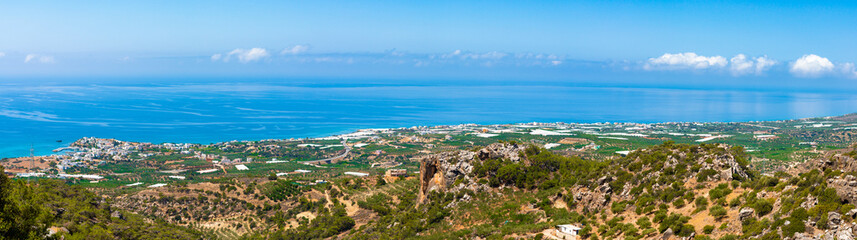 Fototapeta na wymiar Makrigialos unique skyline aerial view, south east Crete Greece. Popular Mediterranean travel destination vacation resort, unspoiled beaches, clear turquoise ocean waters. Travel destination concept. 