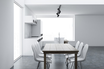 White loft kitchen and dining room interior