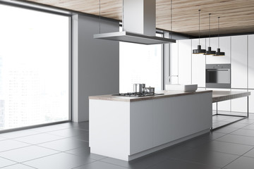 White loft kitchen corner, wooden ceiling