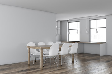 White dining room corner, wooden table