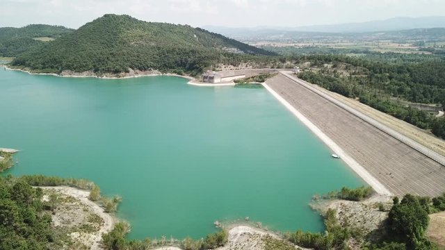 Drone aerial view of the dam of the lake Montedoglio an artificial lake, one of the biggest in Europe. Tuscany. Italy